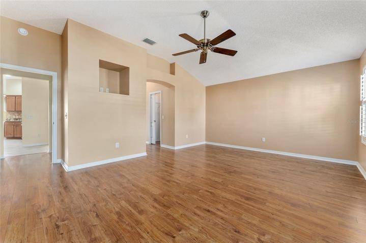 PRIMARY BEDROOM - View shows ante-room (L), wall cut out for TV (center), & hallway to ENSUITE BATHROOM