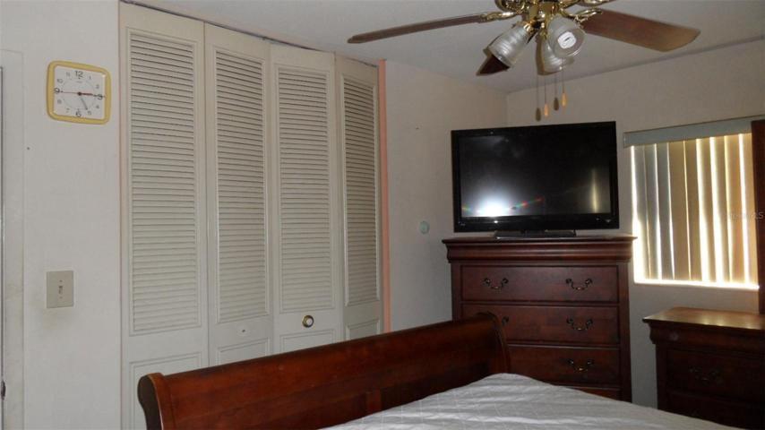 2nd bedroom has ceiling fan/light and large closet