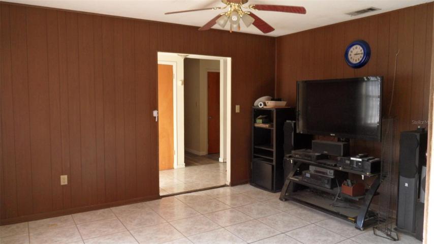 Family is off the foyer to the right and has a window looking to front of home, ceiling fan/light and easy access to the kitchen