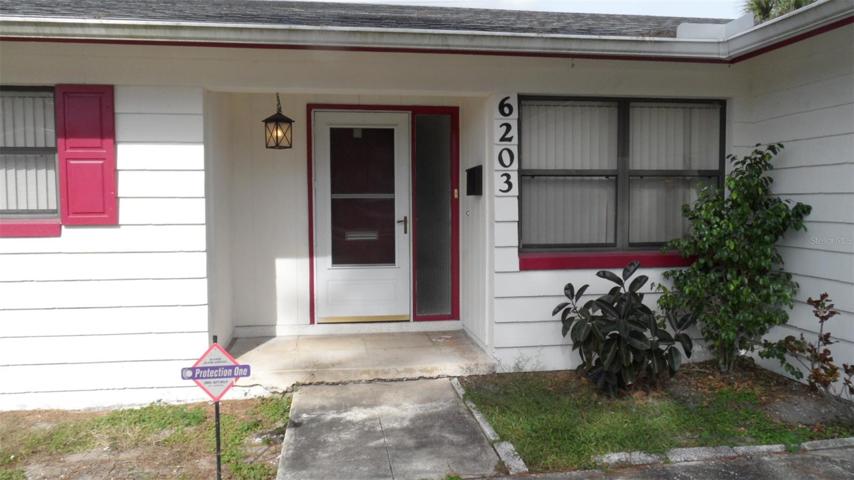Entry to 6203 Castlewood Lane *to the left is 3rd bedroom window and to the right is family room window