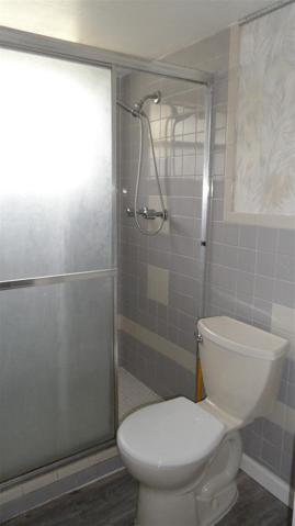 Primary bathroom has separate shower (with window) and commode area for privacy