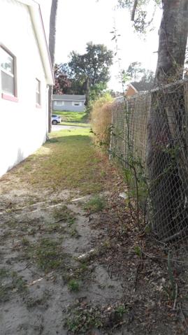 From rear yard this is the view to the road on the right side of the home,