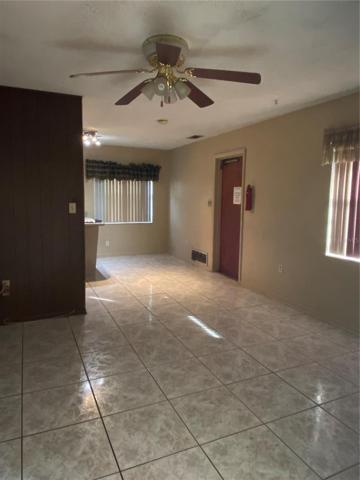From foyer looking through family room to kitchen eat-in area and door to garage