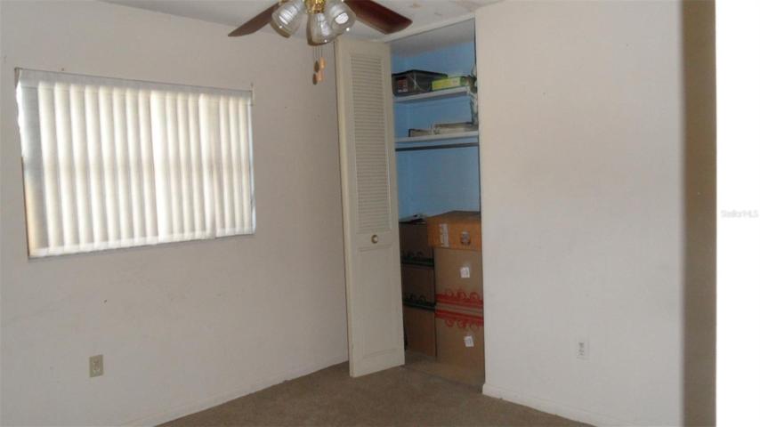 3rd Bedroom has a window facing the front of the home, ceiling fan/light and built-in closet