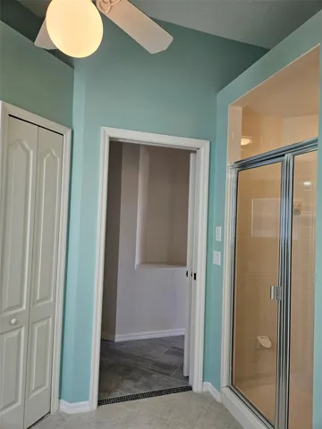 Step in shower with door and linen closet