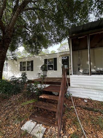 Front steps leading to deck, front door and front porch