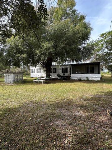 Front of home looking from front corner of yard