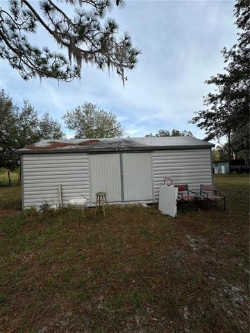 Larger shed w/ electric and water hook-up and in Great Shape (Double Doors closed)