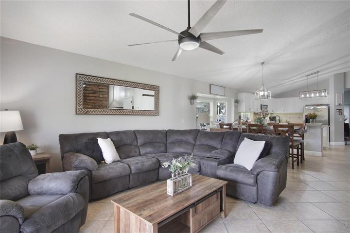 Oversized sliding glass doors access the lanai and tile floors set on a diagonal are pleasing to the eye while being easy to maintain!