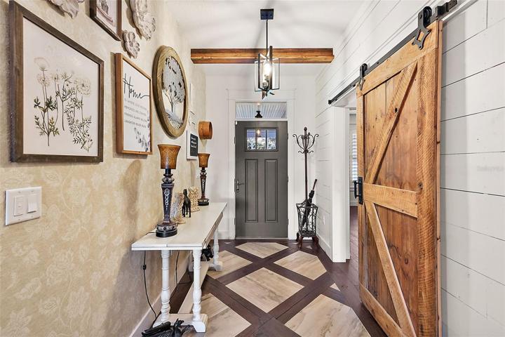 Foyer with inlaid wood & tile flooring.