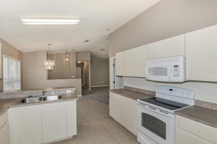 Tiled Contemporary Kitchen To Open Dining