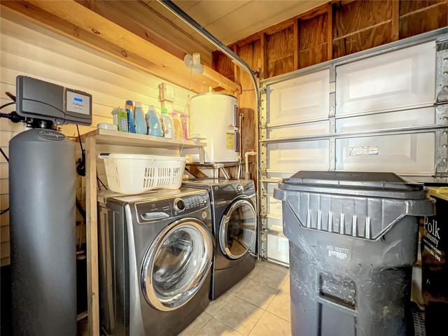 Storage shed with golf cart garage door and washer/dryer