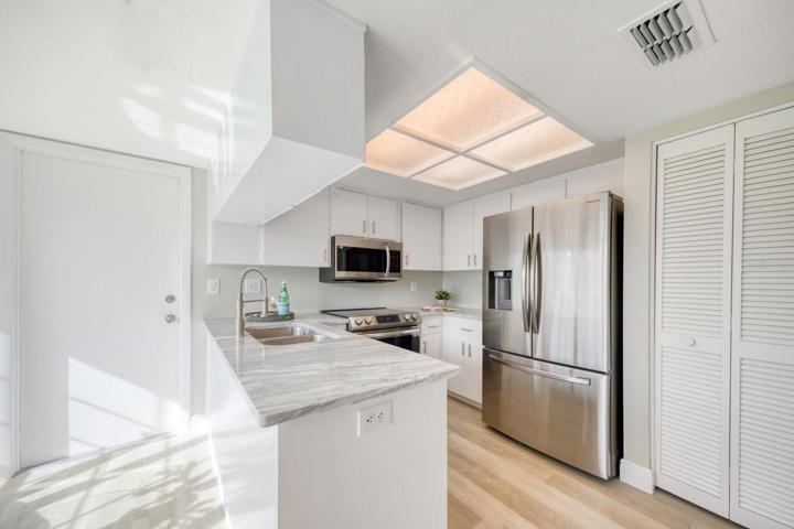 Kitchen renovation includes new stone counters, all new stainless steel appliances, cabinet coating, fixtures & hardware~