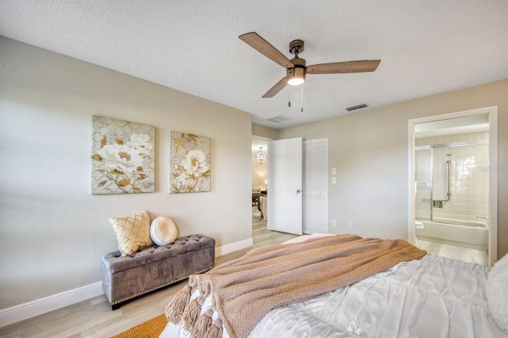 Matching new flooring, fresh neutral paint, new baseboards & ceiling fan make this move-in ready~