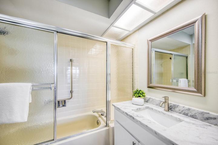 New vanity with stone counter and fixtures in the master bathroom~