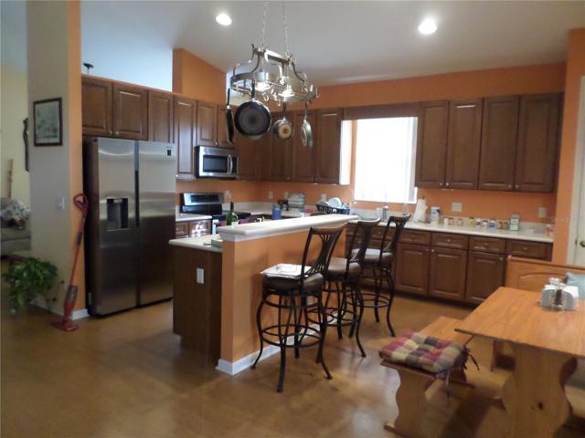 KITCHEN WITH BAR & BREAKFAST AREA