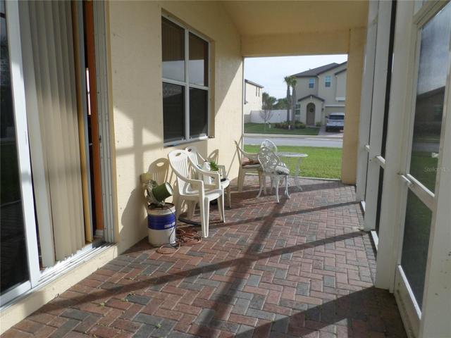 SCREENED PORCH HAS PAVERS