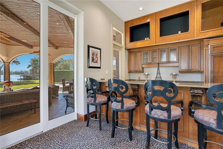 Game Room with full barand built ins for 3 TVs