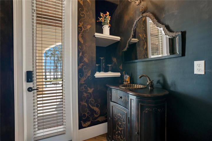 Half Bath downstairs with access to pool patio