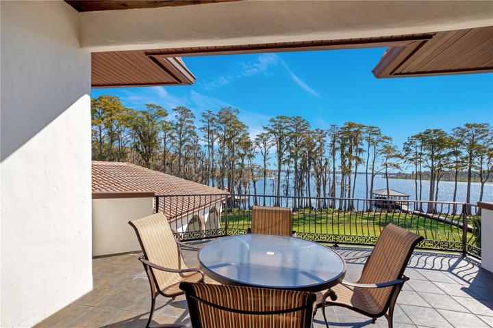 Upstairs balcony view to lake and pool