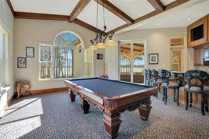 Game Room with full barand built ins for 3 TVs