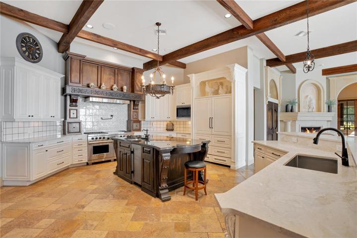 Kitchen features: Wolf Double Oven/Griddle, Sub Zero refrigerator and freezer, Wolf Microwave, ice maker, warming drawer, pot filler, dishwasher and disposal.