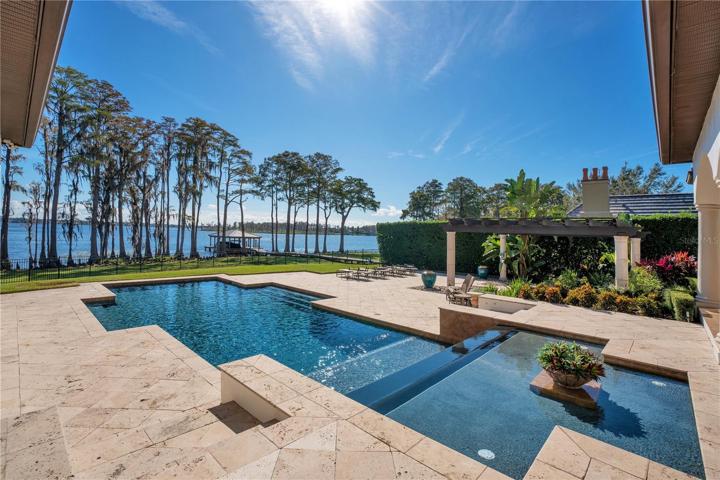 salt water, heated infinity pool with water fall feature