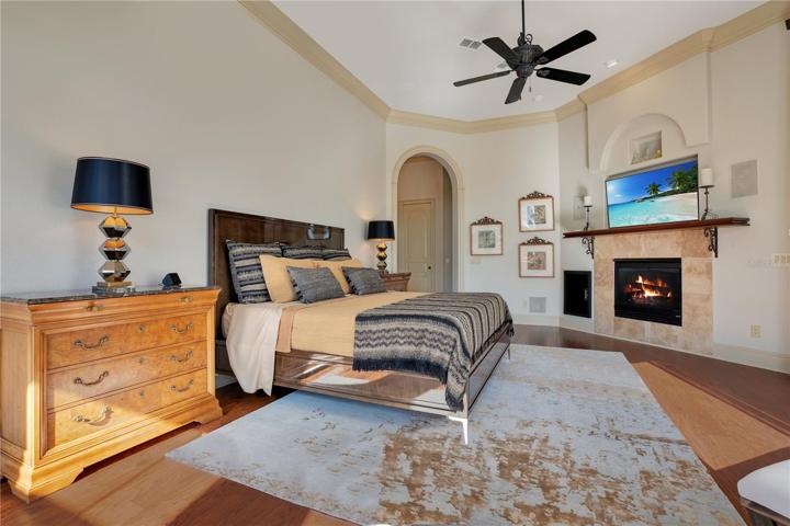 Primary Bedroom with natural gas fireplace and electric shades