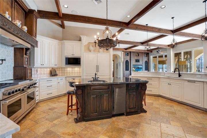Kitchen features: Wolf Double Oven/Griddle, Sub Zero refrigerator and freezer, Wolf Microwave, ice maker, warming drawer, pot filler, dishwasher and disposal.
