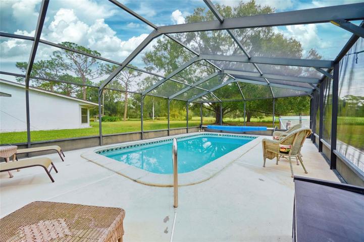 Pool and lanai area with awesome golf course view!