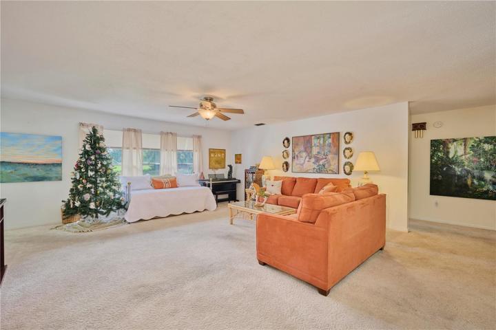 Reverse view of living room.  The hallway in the back leads into the master bedroom area.