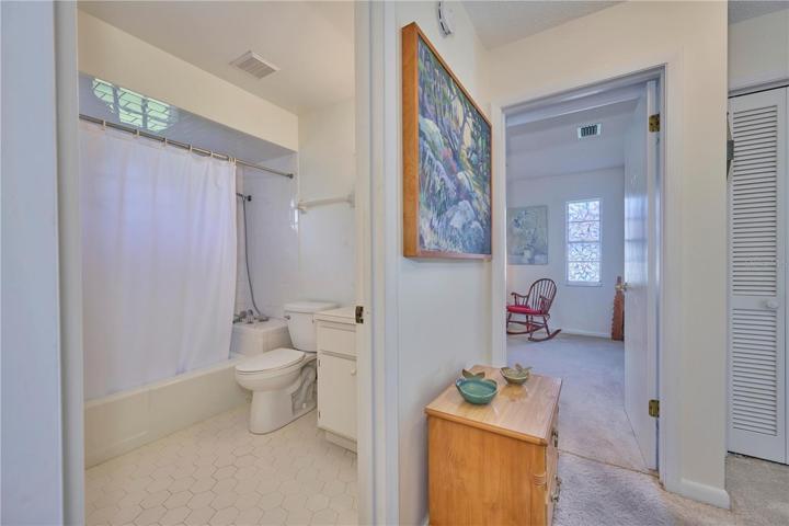 Guest bathroom and view into bedroom 3