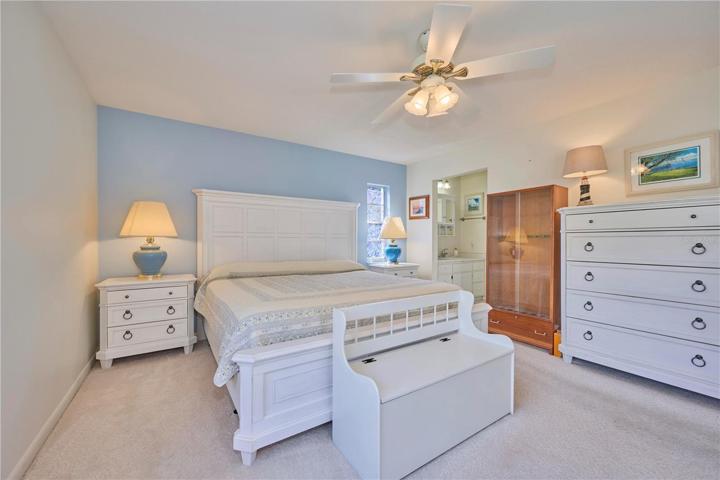 Reverse view of master bedroom with peek into ensuite bathroom area.