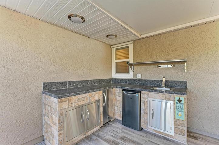 Outdoor kitchen off master bedroom