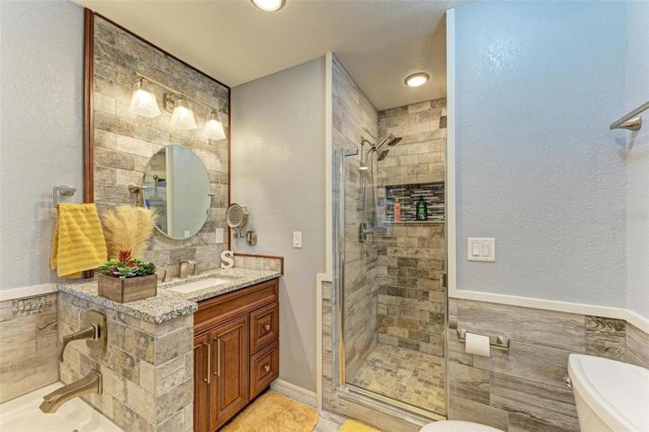 Primary bathroom with separate tub and shower