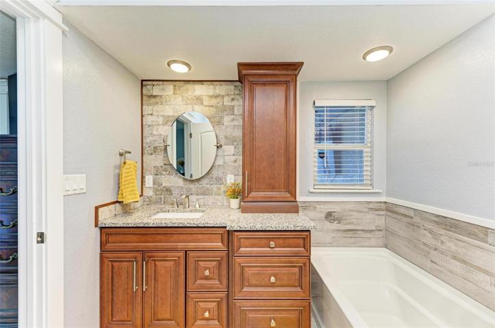 Primary bathroom with separate tub and shower