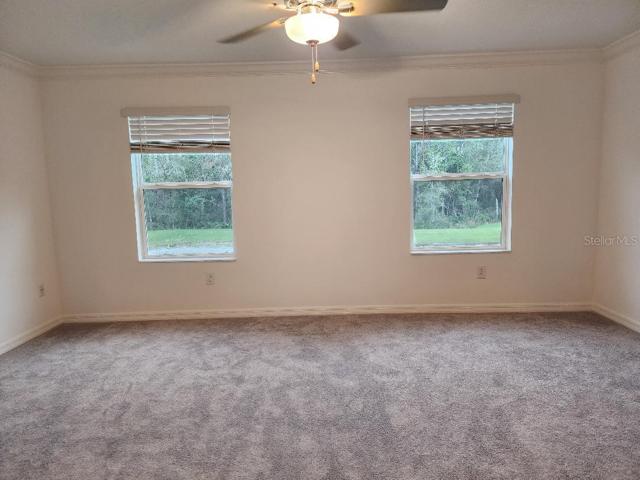 Master brm with blinds open overlooking conservation