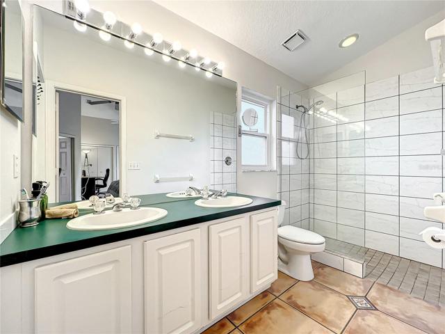 Master bedroom with large walk-in closet and walkin shower