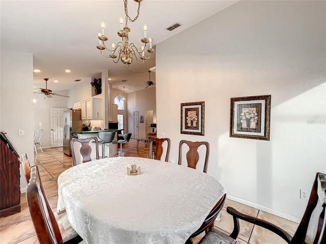 Spacious dining area and view of the kitchen and family room.