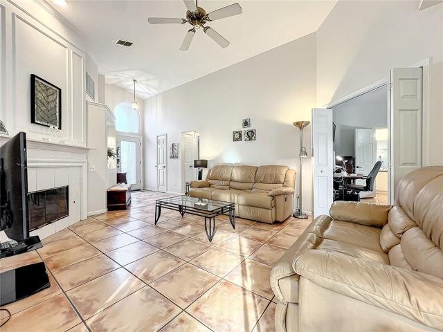 Elegant family room view with gas fireplace and vaulted ceilings.