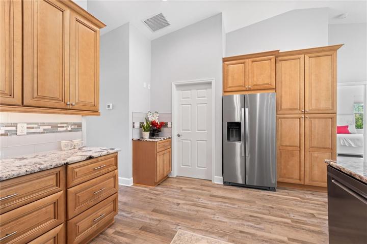 kitchen is connected to laundry room