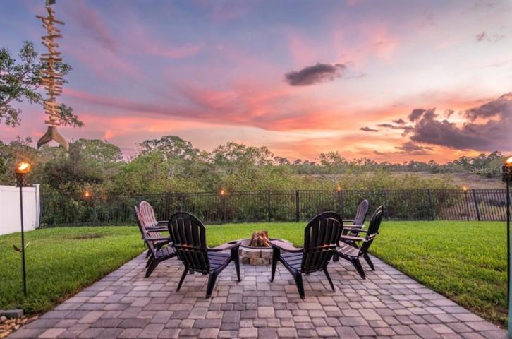 COVERED PATIO WITH PAVERS - Spacious Covered Patio view Stunning Views including Preserve & McArthur Golf Club.