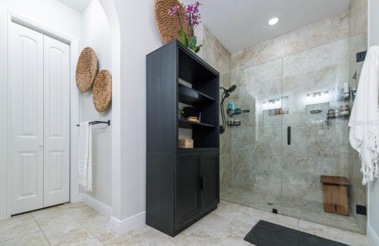 MASTER BATHROOM SHOWER - Wall Tile to Ceiling & Seamless Glass Shower Door.