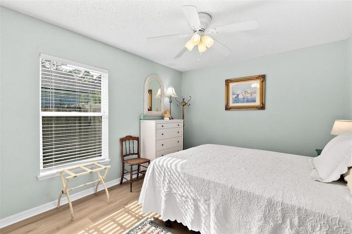 bedroom 4 with ceiling fan, LVP floors