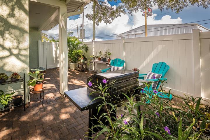Side yard grill area oak tree