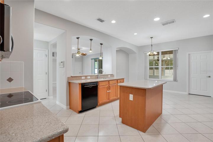Plenty of space in this large kitchen not only to cook but also to enjoy the meals in the large eating area in the back