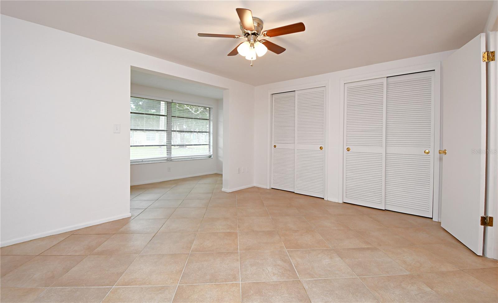 The master bedroom is connected to a delightful Florida room attached.