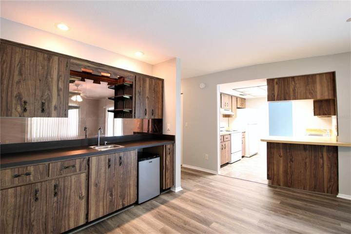 Family room with wet bar and mini fridge