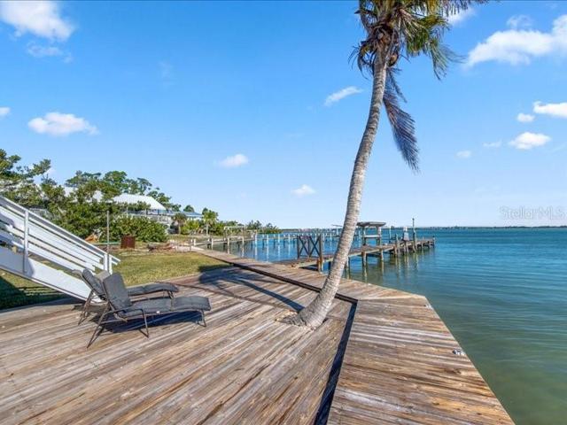 Decking extends from the dock to the front of the house and around to the back of the house!