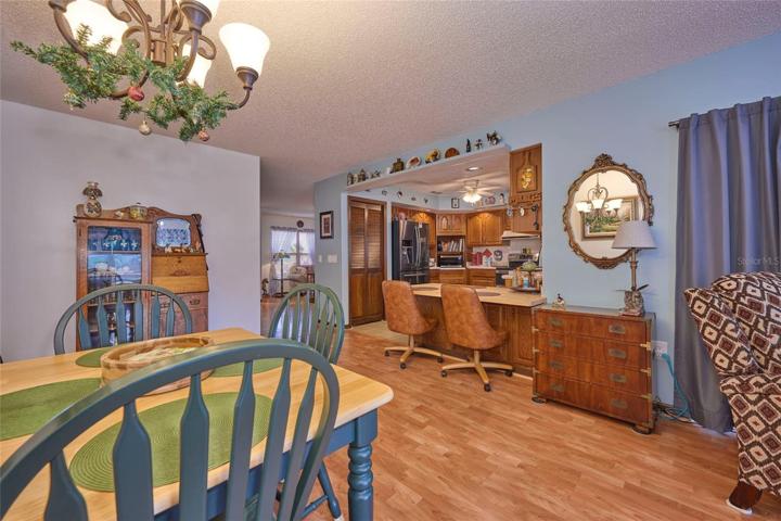 Reverse view looking back into kitchen and living room from family room